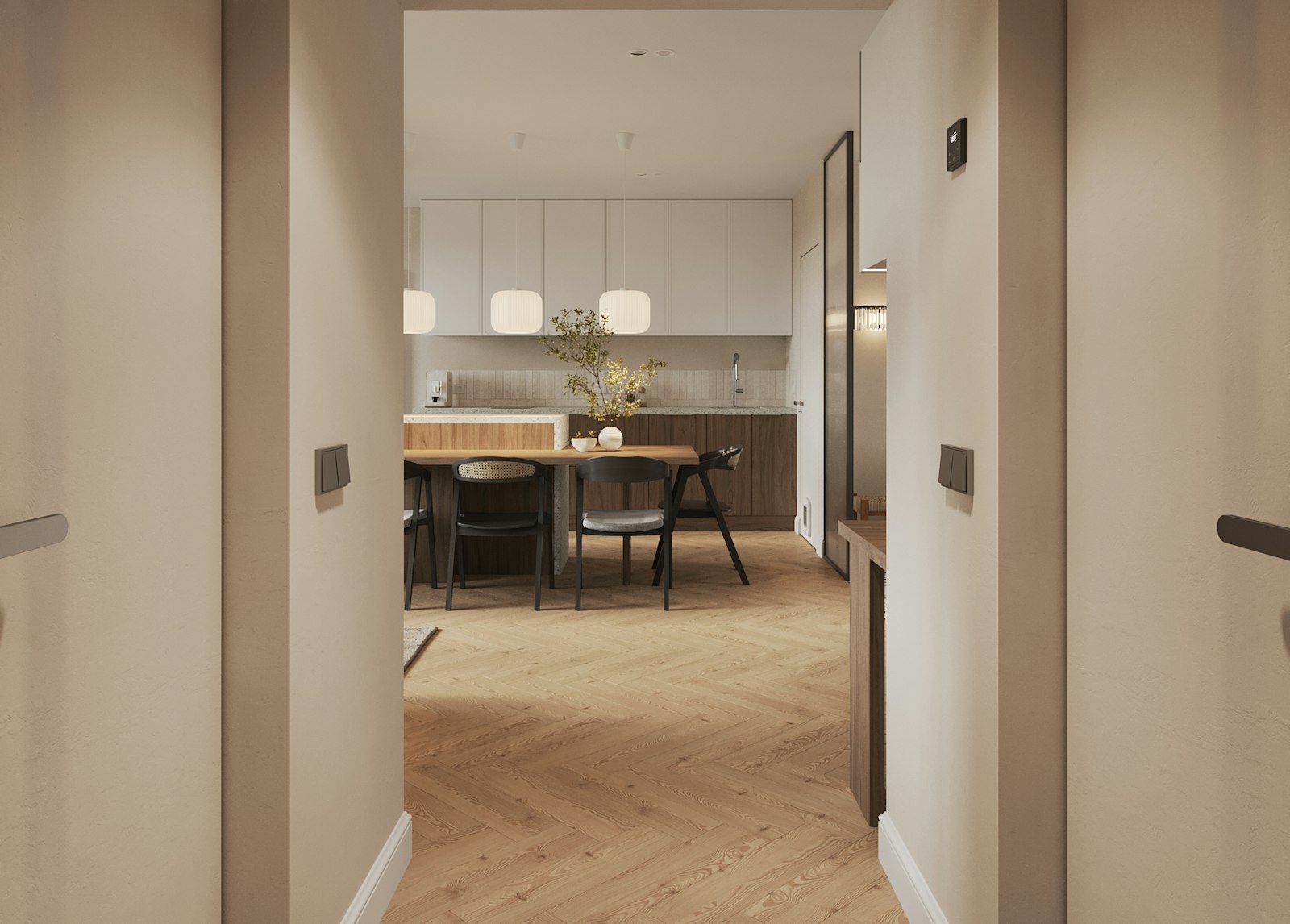 A hallway opening onto a warm kitchen and dining room with herringbone floors