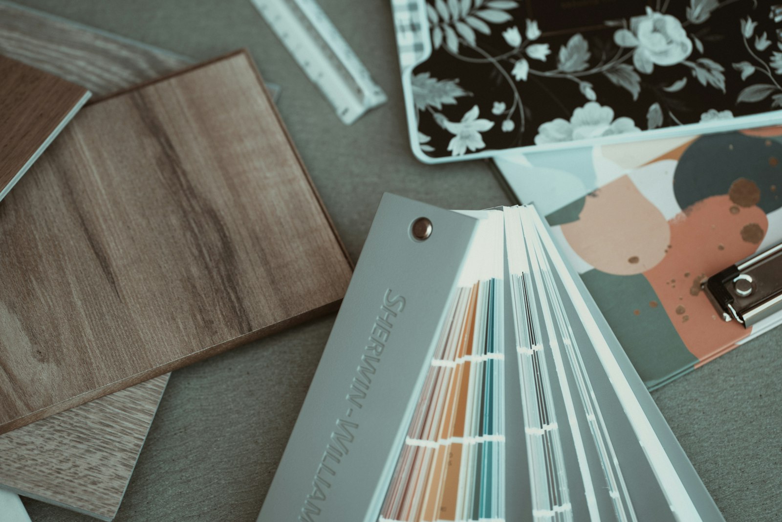 Wood, wallpaper and paint samples laid out together