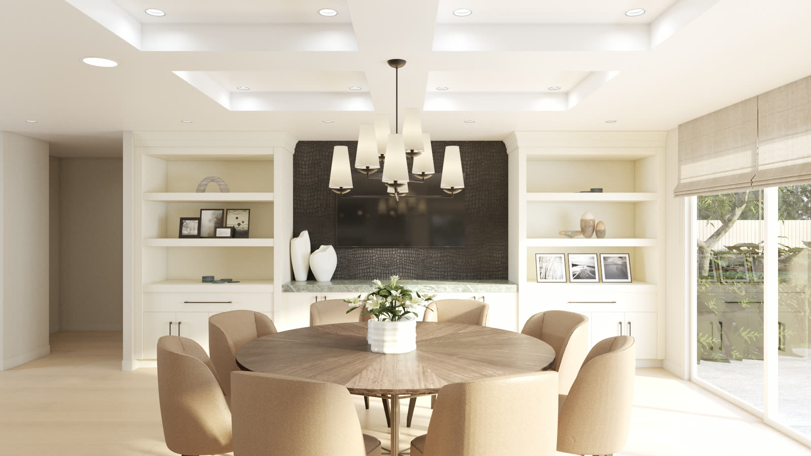 A dining room with a round timber table under a shaded chandelier, set against a dark textured media wall between cream built in shelving